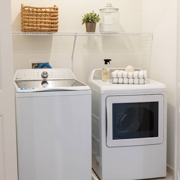 a small laundry room with a washing machine and a dryer