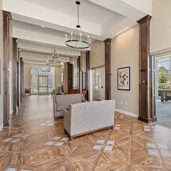 the estates at tangle wood living room with pool table at the winslow 62+ apartments, west st paul, mn