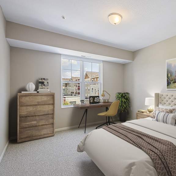 an empty bedroom with a bed and a desk at the winslow 62+ apartments, minnesota, 55118