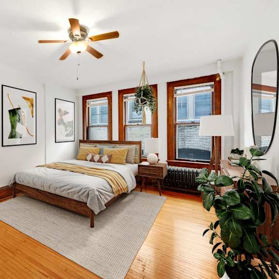 Thumbnail 3 of 3 a bedroom with a bed and a ceiling fan