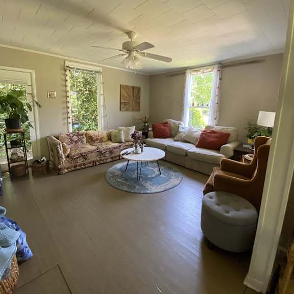 a living room with a couch and a table