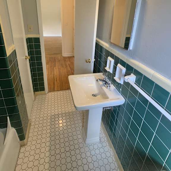 a bathroom with a sink and a mirror