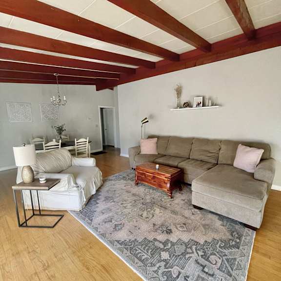 a living room with two couches and a coffee table