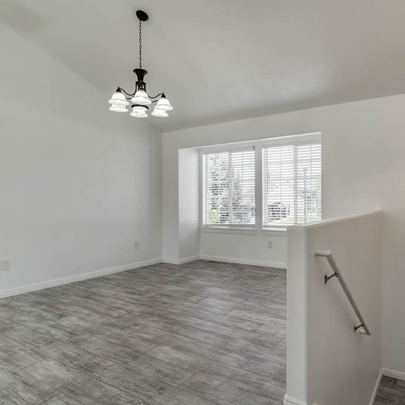 a room with a grey floor and a white door.