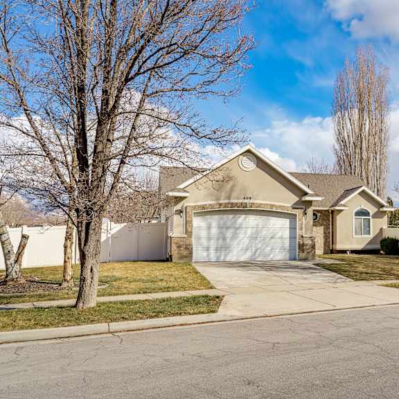 a house with a driveway and a garage door