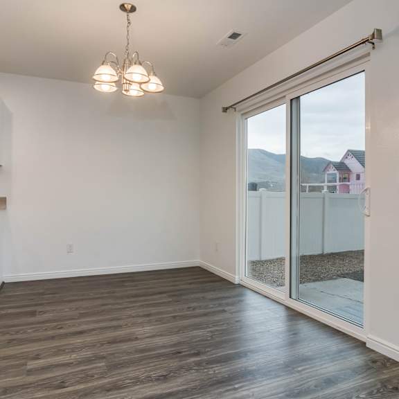 a kitchen with white cabinets and a microwave.