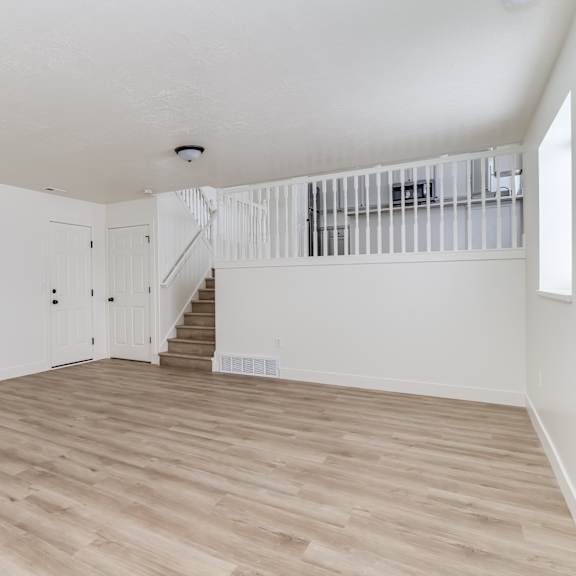 a room with a staircase and a white ceiling.