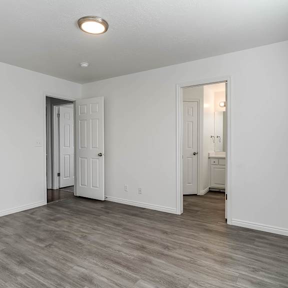 a room with a grey floor and white walls.