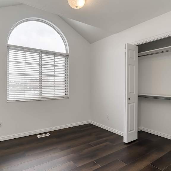 a room with a window and a sliding door.