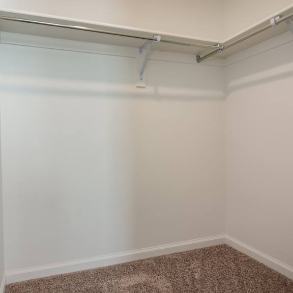 a room with a carpeted floor and white walls.