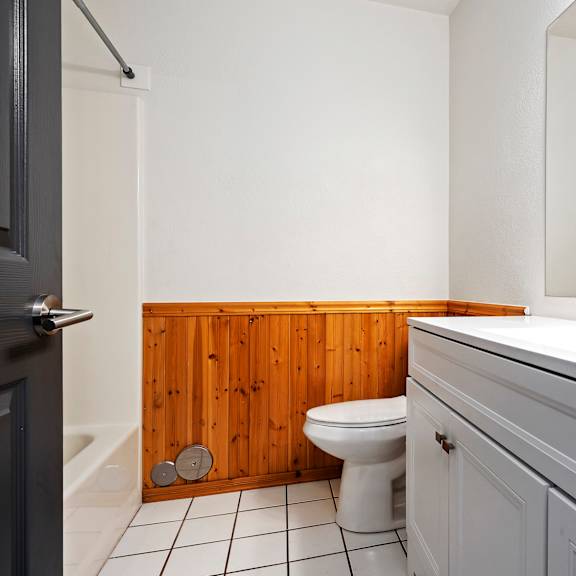 an empty bathroom with a toilet and a sink
