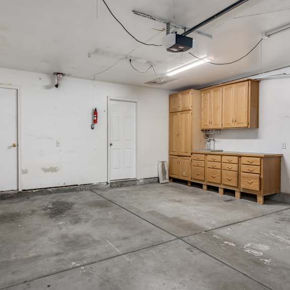 a kitchen being remodeled in a room with wooden cabinets