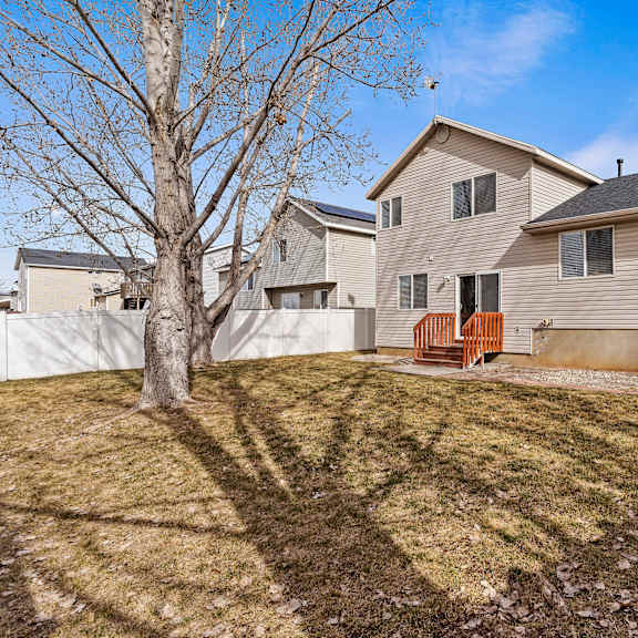 a house with a tree in front of it.