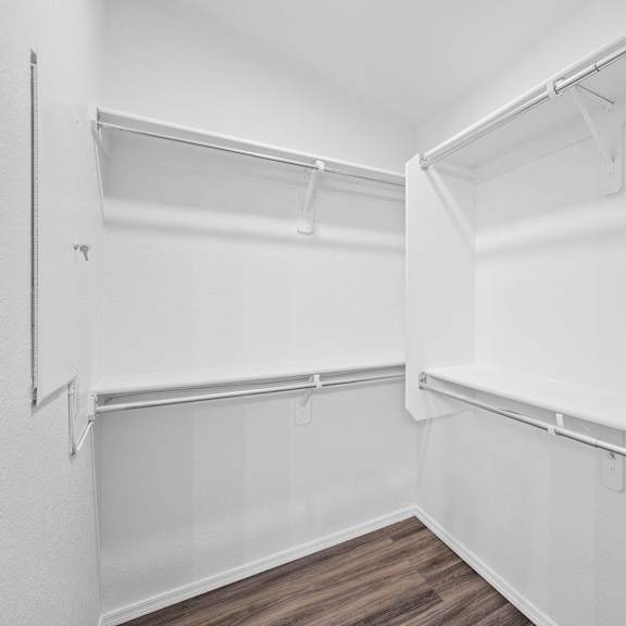 the preserve at ballantyne commons empty walk in closet with white walls and
