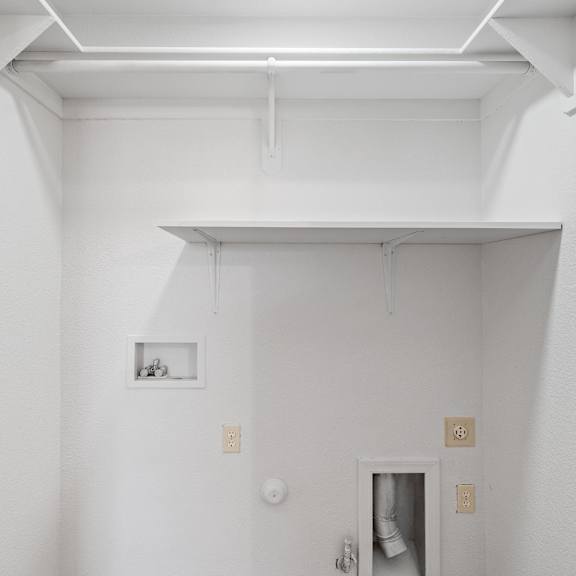 a white room with a door and a white ceiling