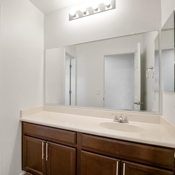 the preserve at ballantyne commons apartment bathroom with sink and mirror