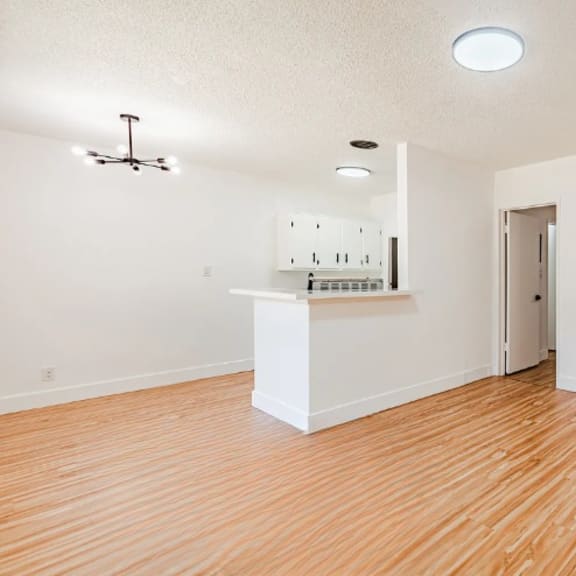 a room with a white cabinet and a ceiling fan.