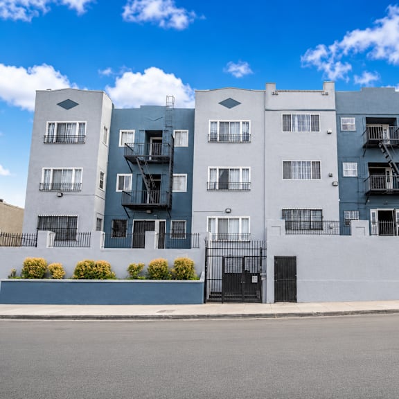 a modern apartment building with balconies and staircases.