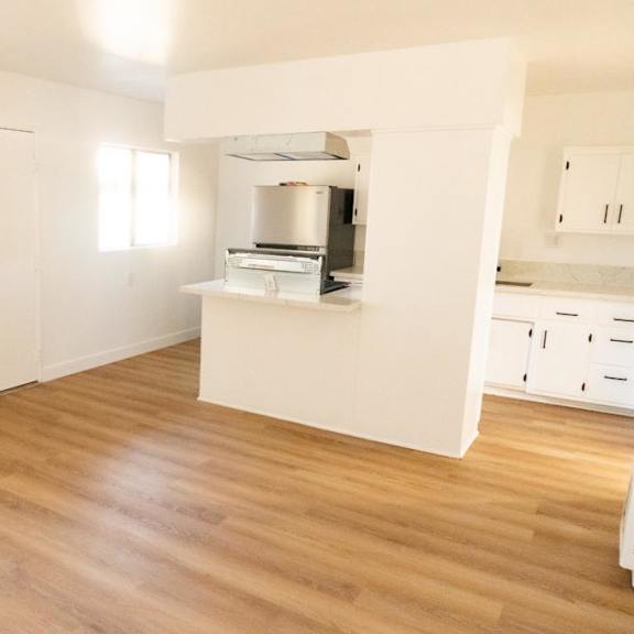 a kitchen area with a countertop and cabinets.