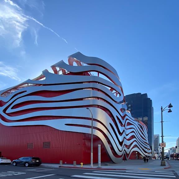 a large red building with a white and red striped design.