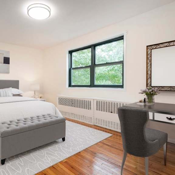 a bedroom with a large bed and a chair.