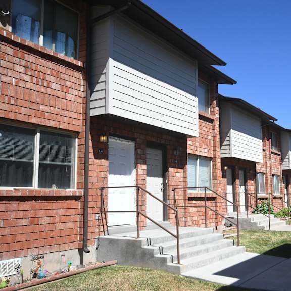 a row of houses with stairs in front of them