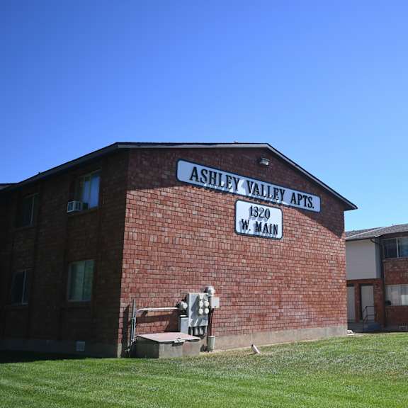a brick building with a sign on the side of it