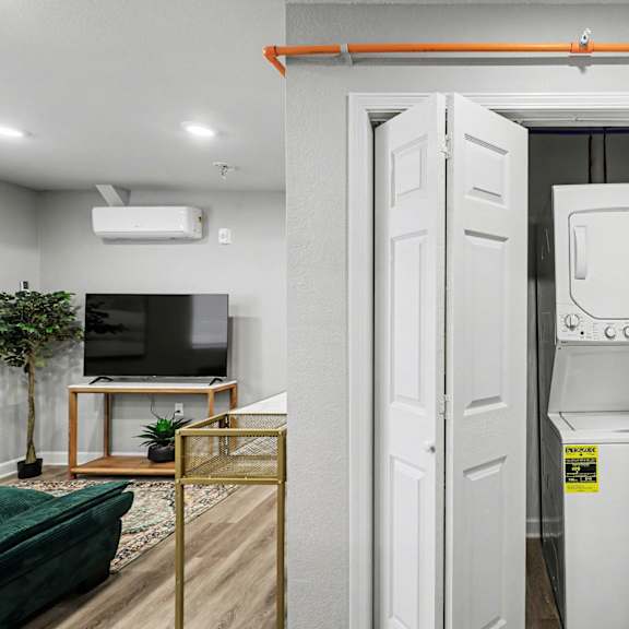 a white tank sits in a doorway between two white doors at mayfair apartments, kansas city, 64145