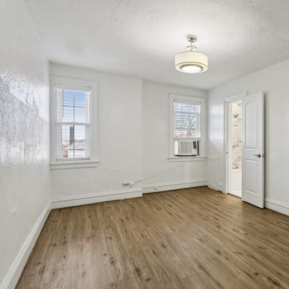 a room with wooden floors and white walls at shipyard shores apartments, newport news, 23607