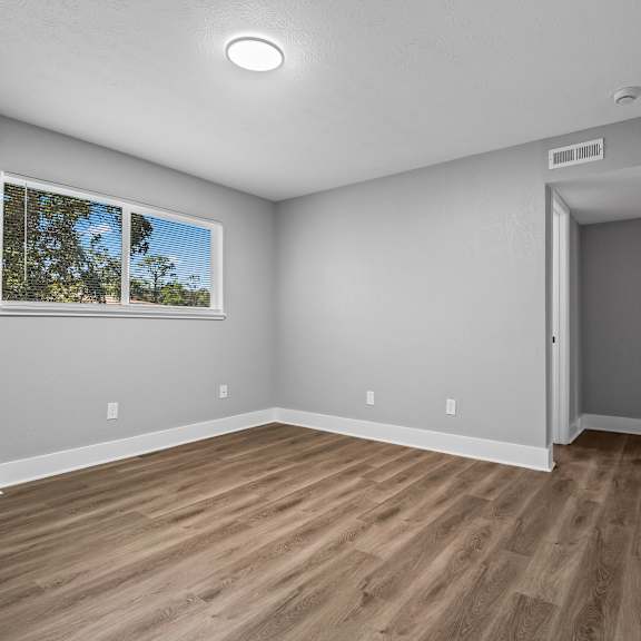 contemporary finishes include wood and tile flooring at serenity place central, tallahassee, florida
