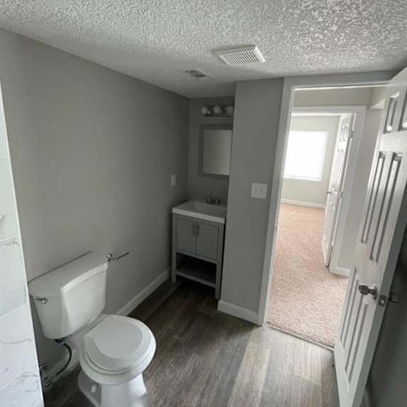 a bathroom with a toilet and a sink