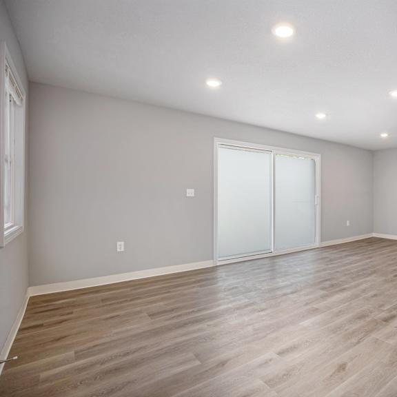 a room with wooden flooring and a bar counter.at palisades apartments, kansas city missouri