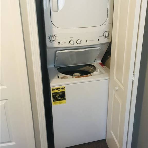 a washer and dryer in a small closet