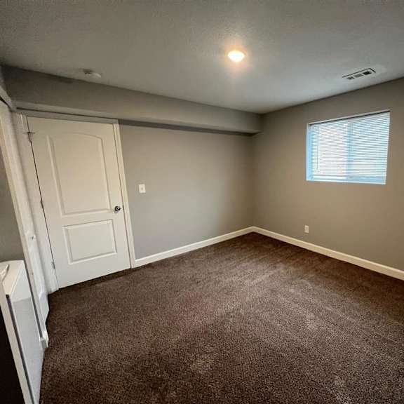 a bedroom and a window