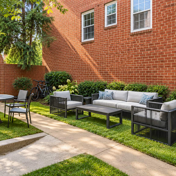 private courtyard with modern outdoor furniture at the tuscan hills ahr llc apartments, baltimore