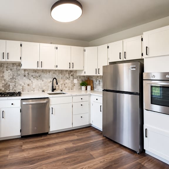 bright kitchen with decorative tile backsplash at the tuscan hills ahr llc apartments, baltimore, maryland