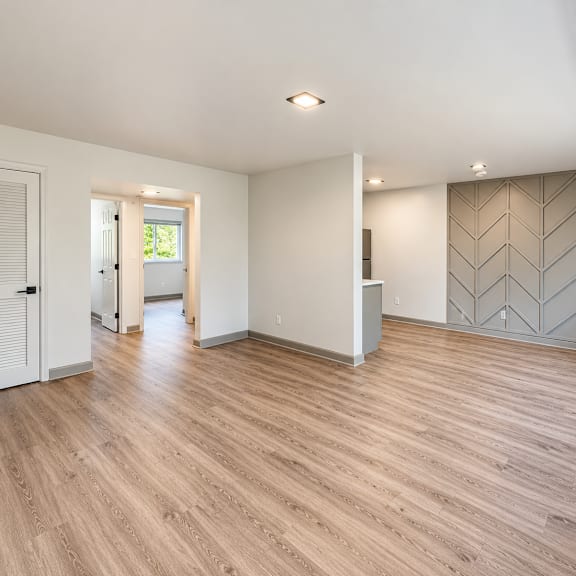 spacious living room with chevron accent wall at the wyman hills ahr llc apartments, maryland, 21211