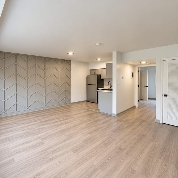 open concept living area with modern kitchen at the wyman hills ahr llc apartments, baltimore, md 21211
