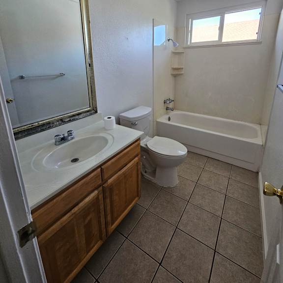 Thumbnail 14 of 14 a bathroom with a sink toilet and a bath tub