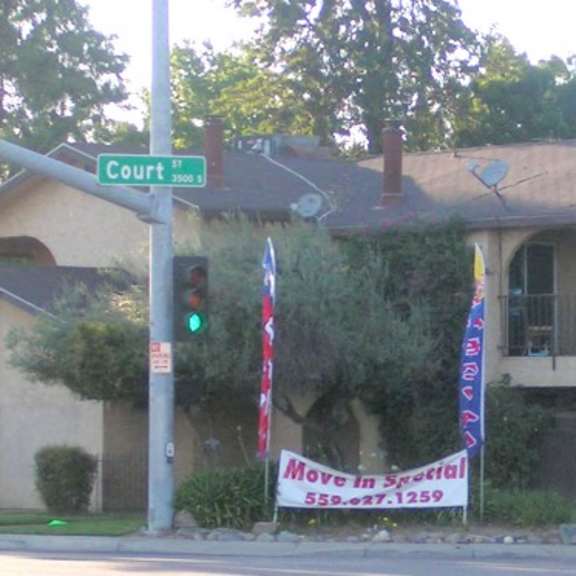 a house with a protest banner on the corner of a street