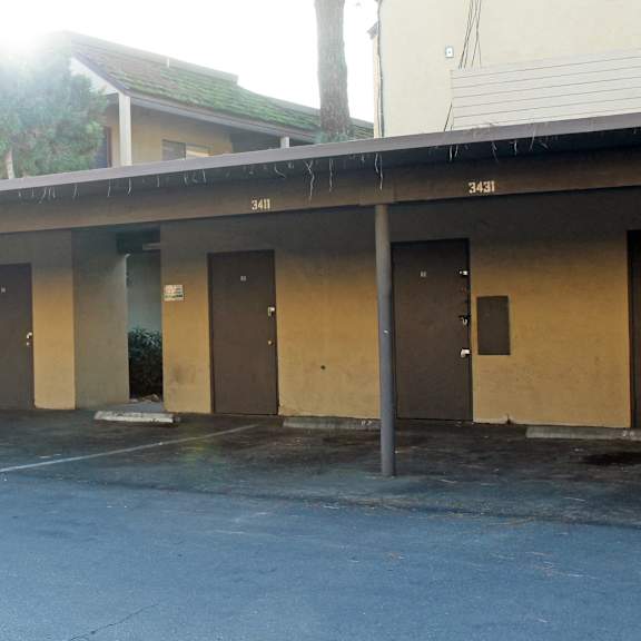 a parking lot with a building in the background.