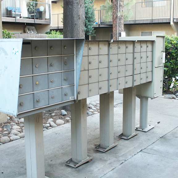 a grey metal structure with a blue panel on the left side.