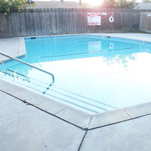 a rectangular pool with a concrete edge and a concrete floor.