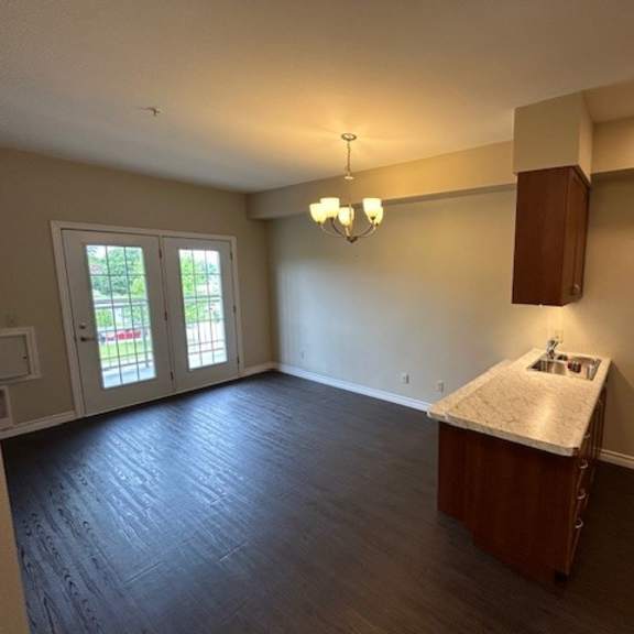 a room with a kitchenette and a window.