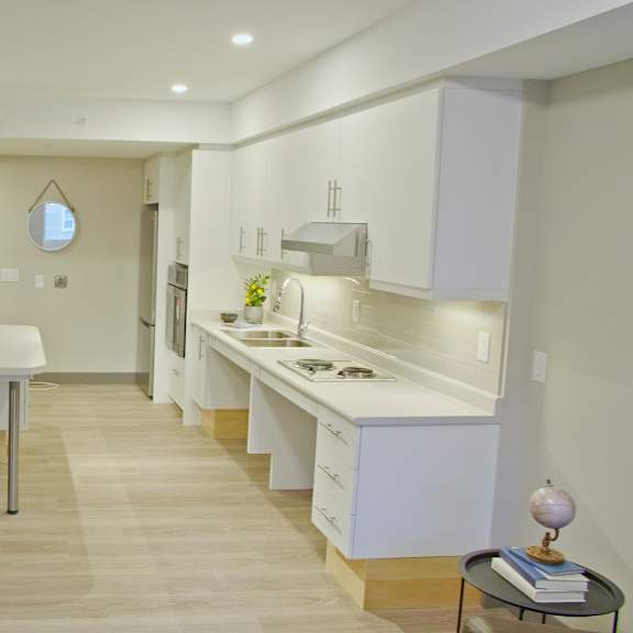 a kitchen with a table and chairs in the middle of the room.