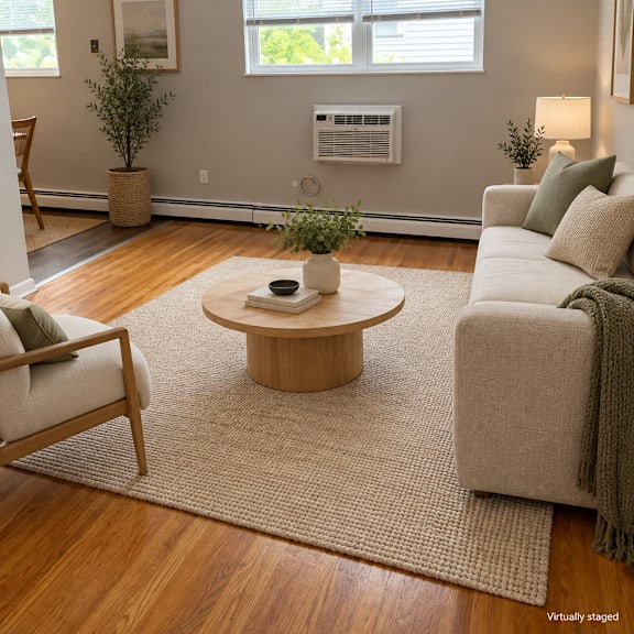 a living room with a couch, chair, and coffee table.