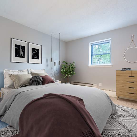 a bedroom with a bed, nightstand, and a plant.