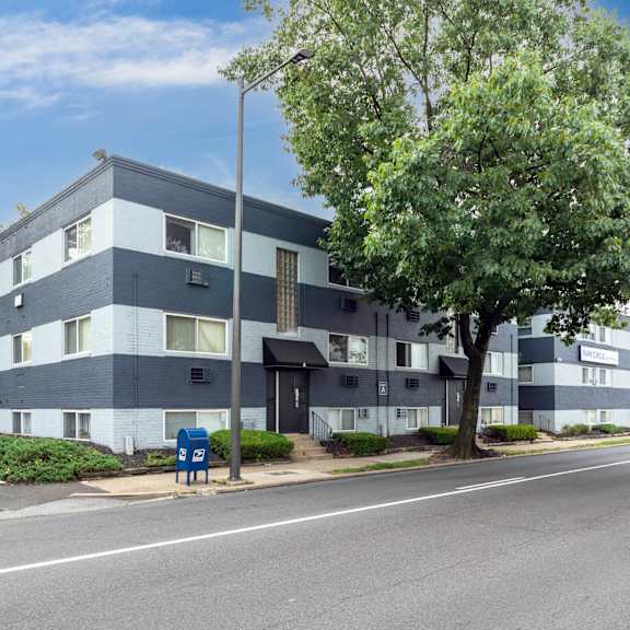 a modern apartment building with a blue and white facade.