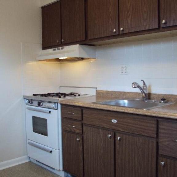 a kitchen with a stove and a sink
