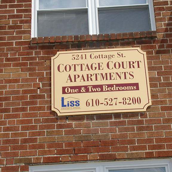 a large sign on the side of a brick building